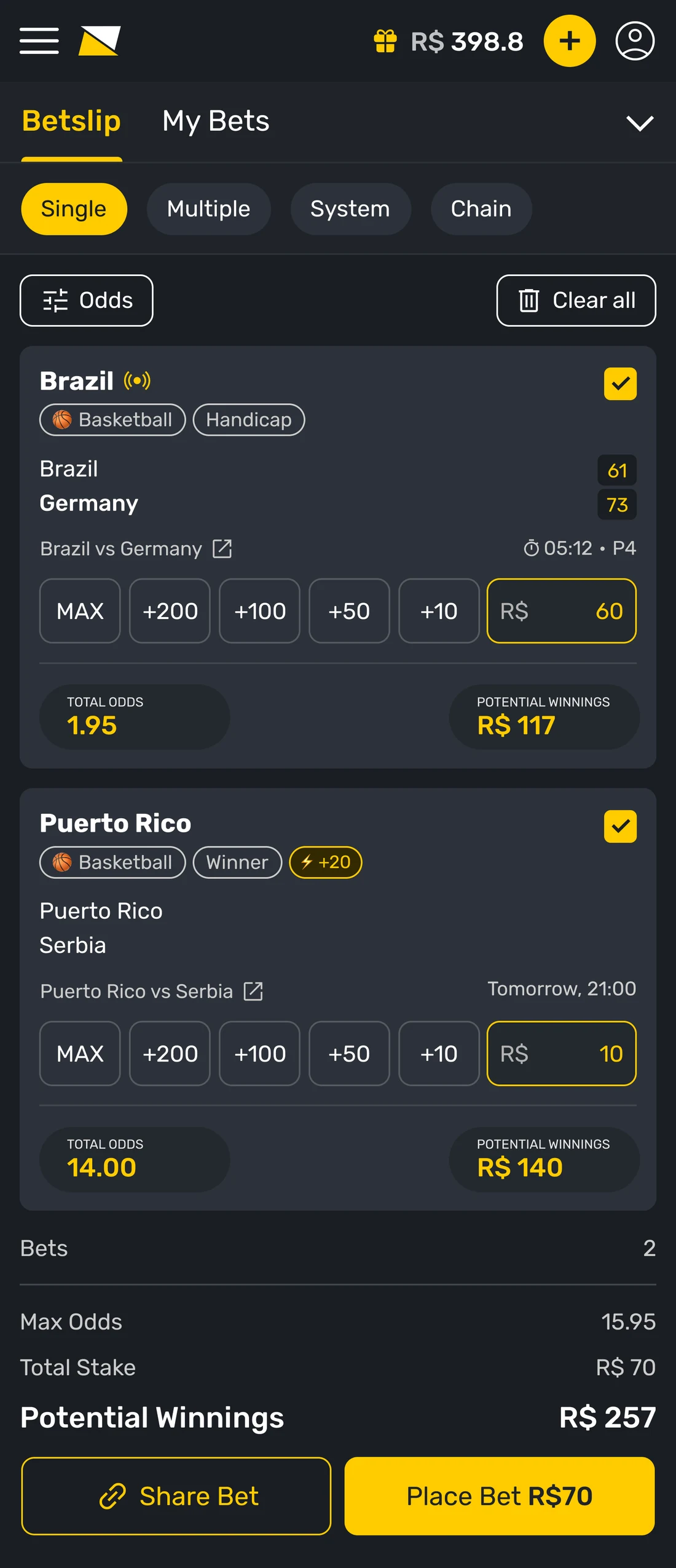 The betslip on the Single tab with two bets as separate cards. Each card carries the selection, sport and market chips, the live score, a row of quick stake amounts with a typed field, and its own total odds and potential winnings.